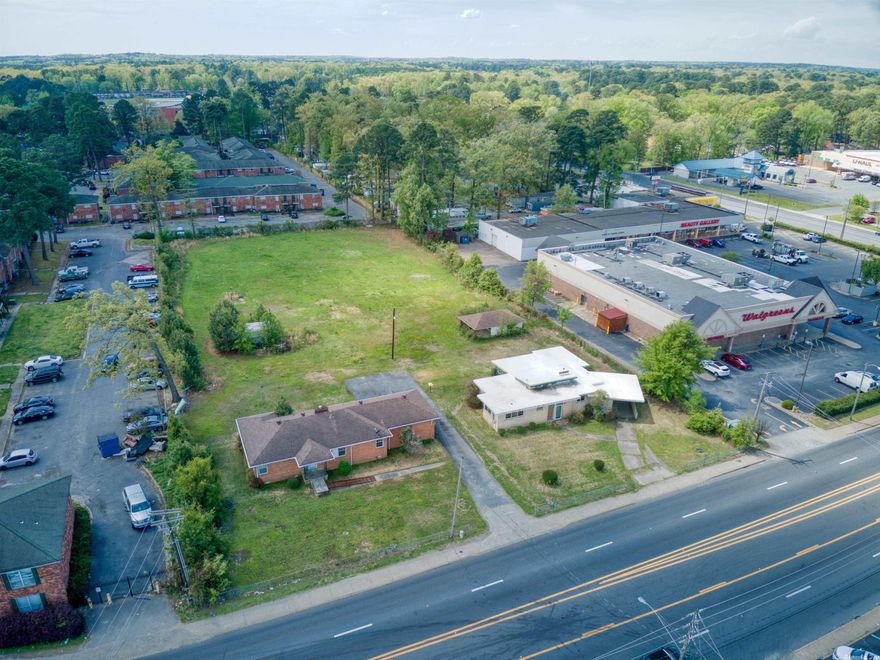 RARE FIND! House on Acreage in the middle of all the action! Great spot for your next business venture! Unbelievable opportunity to develop up to 2.00+/- Acres within walking distance to restaurants, highways systems, shopping centers, neighborhoods, etc. House is unique and in good condition! Can be sold alone or packaged with 5901 Baseline for the full 2+/- acres