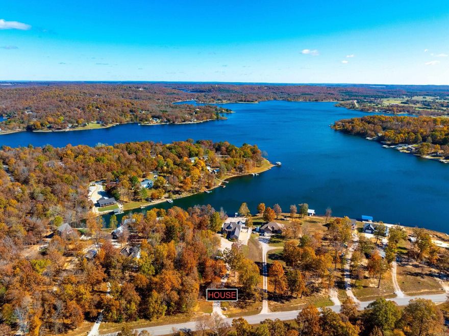 Stunning Waterfront Home on Crown Lake – 4,200± Sq Ft, Move-In Ready!  This beautiful 3 bed, 3 bath custom-built lakefront home offers approx. 2,100± sq ft on the main level and 2,100± sq ft finished walk-out basement—perfect for full-time living or a lake retreat. Enjoy panoramic Crown Lake views from soaring living room windows, vaulted ceilings, and a cozy fireplace. The kitchen features bar seating, a dining nook, and opens to a screened-in porch overlooking the lake.  The main level includes an office or formal dining room(which ever a person decides to use it for), guest bedroom, full bath, and a spacious primary suite with bay windows, double closets, and ensuite bath. A large laundry/pantry leads to a covered carport and 3-car garage.  Downstairs offers a massive rec room, bedroom, bath, kitchenette, and two oversized craft rooms—one ideal for a theater. Step outside to a covered patio, private boat dock, fire pit area, and low-maintenance landscaping.  Bonus: Seller added a new furnace and heat pump in 2023. Located in peaceful Horseshoe Bend, AR, near golf, trails, and three lakes.  Ready to move in and enjoy lake life!