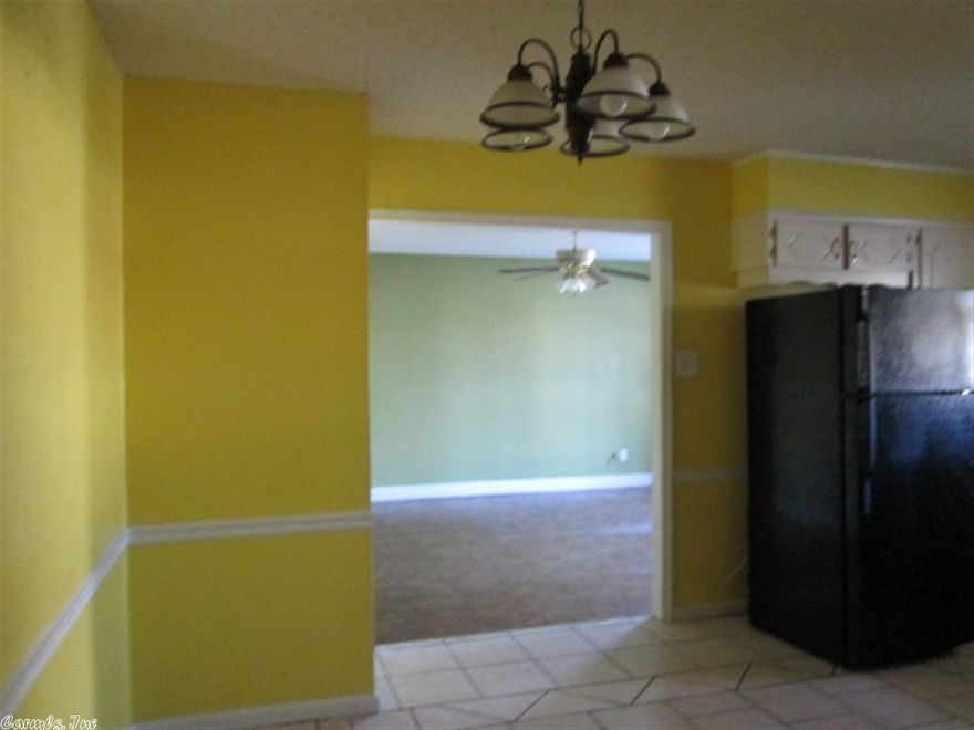 Vinyl siding home with three bedrooms and two baths on one level. Garage has been partial enclosed but could be converted back or used as a fourth bedroom. Kitchen/dining room combination. Great first time home.