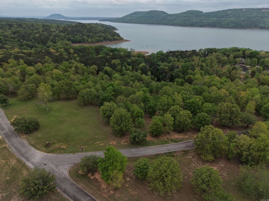 GREERS FERRY LAKEFRONT LOT Large lot in the sought-after Burnt Ridge Estates subdivision. 1.98 Acres with underground utilities and an easy walk to the water.  A boat launch is located in the neighborhood, and you are just minutes to Choctaw Marina or Fairfield Bay by water.  This lot is located between Harper's Cove on Southfork to the West and Party Cove to the East. Bring your plans, build your dream and enjoy the lake.