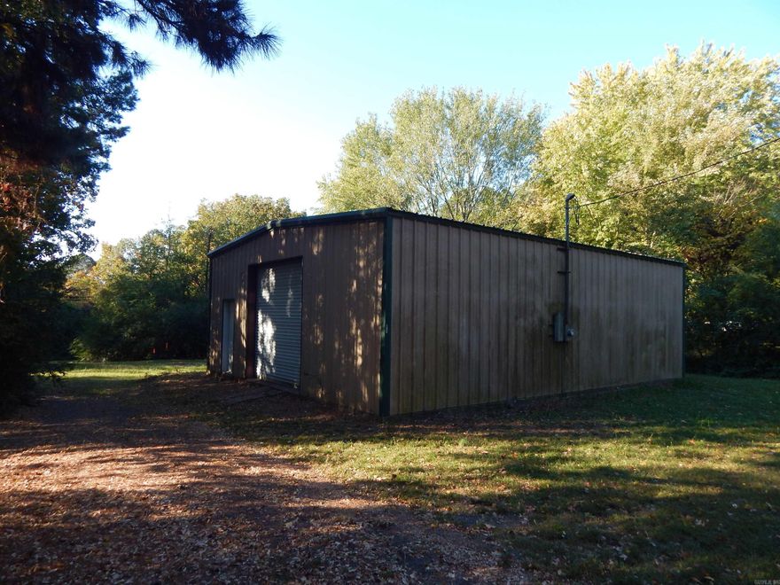 This is a nice location.  Many possibilities.  Could be changed to residental.  Small business.  Store your lake toys. Insulated Shop with electric.