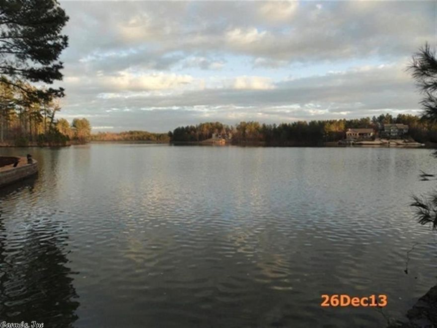 AFFORDABLE AND BUILDABLE LAKE LOT - $59,900...LAKE GRANADA FRONTAGE;  GENTLE DOWN SLOPE TO WATER ALLOWS FOR EXPANSIVE LAKE VIEWS...SEAWALL IN PLACE... SURROUNDED BY BEAUTIFUL LAKE HOMES; CLOSE PROXIMITY TO EAST GATE (HWY 5) ALLOWS FOR EASY TRAVEL TO HOT SPRINGS AND LITTLE ROCK... YOU WON'T BE DISAPPOINTED IN THIS PRIME LAKE PROPERTY AND ALL THE AMENITIES THAT VILLAGE LIFE HAS TO OFFER...