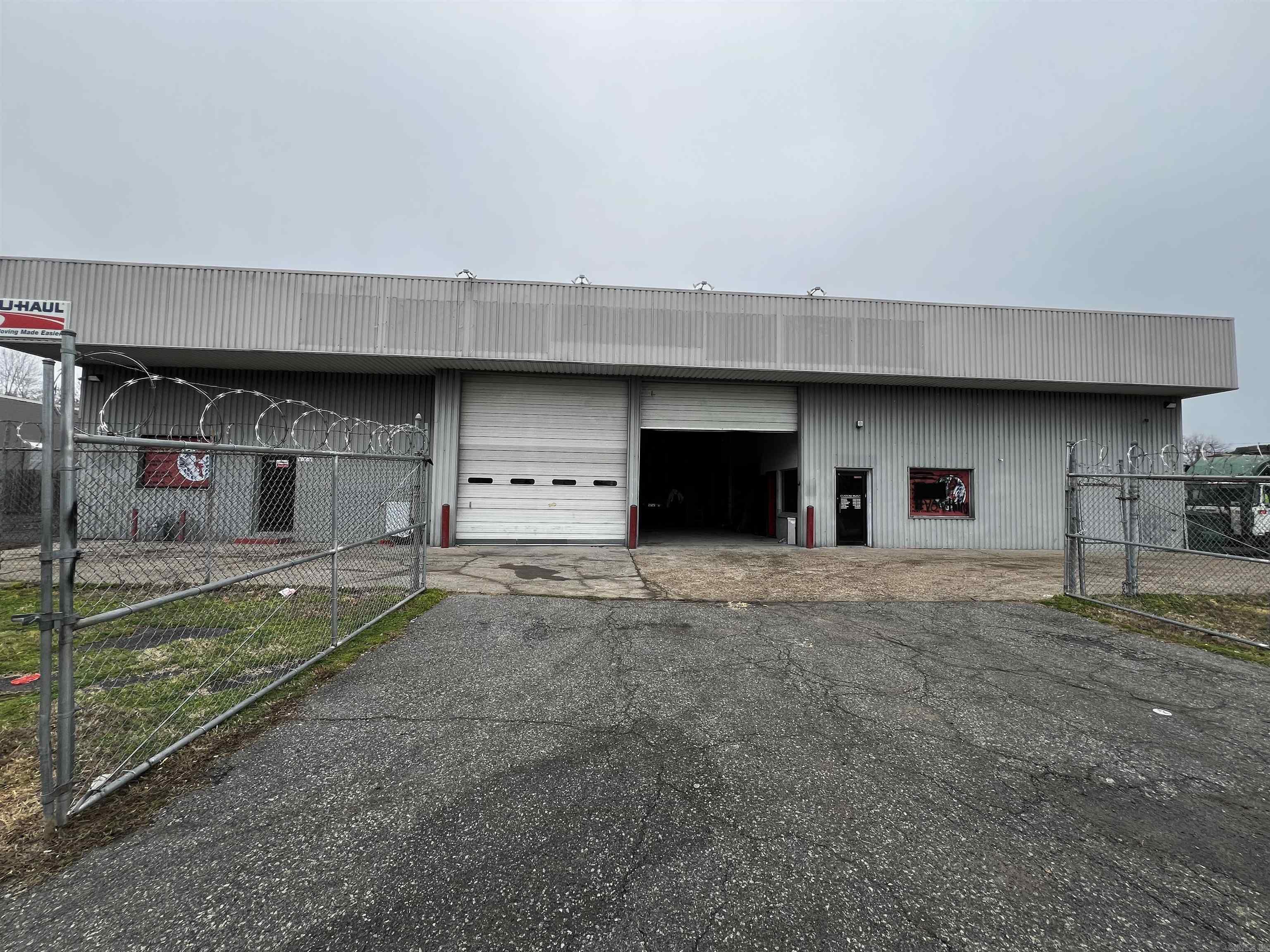 This shop has all you need to start up your business on day one. It has multiple work bays with retractable overhead doors. The building conveys with a car lift, framing machine, two paint rooms, tools, chrome machine. Building has two offices and three bathrooms. Lots of parking inside the building along with several parking spaces inside the fenced in land area. This could be a great money maker for the right buyer or an investor that would like to rent the space out for monthly income flow. Bring an offer and let's make a deal.