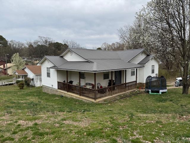 GREAT 3BR, 2BA HOME IN TOWN! This home was fully remodeled in 2016 and features 3 bedrooms and 2 bathrooms including a master suite with walk in closet and private bathroom with garden tub. Living room, kitchen, dining combo with bar and appliances. Big laundry room with storage. Vaulted ceiling with can lighting. Large covered deck and wrap around porch. Storage building. All this on corner .43 of an acre!
