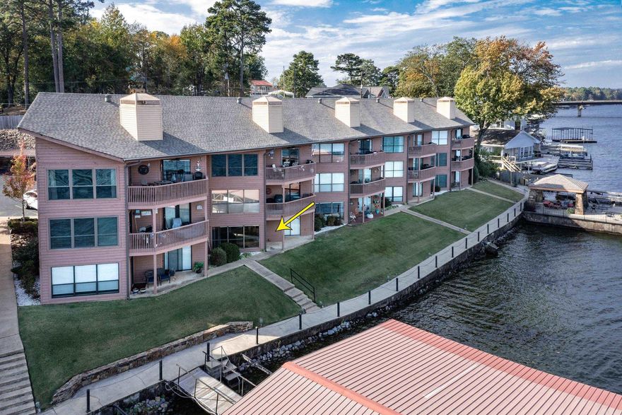 Lower level condo with covered boat slip (Slip C-4) & dock just steps away from the back door. Incredible main channel lake Hamilton views to enjoy from the back porch or the beautiful community gazebo. 1 Covered parking space (Space C-4). Swimming pool. Walk in level, two bed, two bath, updated flooring, all electric, wood burning fireplace, gated entrance, nice community gazebo to enjoy family gatherings. Outside closet storage for your water toys. Location is excellent, very convenient to all amenities. Great place to call home every day or just weekends! See agent remarks.
