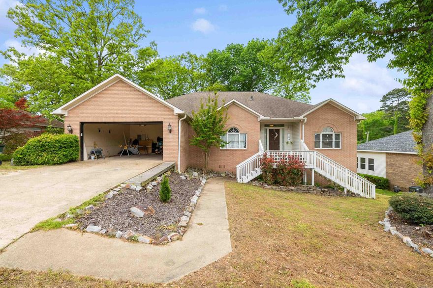 TThis well-maintained brick home offers a spacious and great floor plan perfect for comfortable living and entertaining. Featuring 3 bedrooms, 2 bathrooms, with 14' x 35' bonus room upstairs offering versatility for 4th bedroom, office, game room or gym. The home includes granite countertops in the kitchen, a convenient 2-car garage, a dedicated laundry room, and peaceful sun porch to relax and watch the sunset on Lake Hamilton.  Below the main level, a LARGE workshop offers excellent space for hobbies, projects, or additional storage, along with adjoining unfinished multi-purpose areas ready to be customized to fit your needs whether for a home gym, studio, or extra living space.  Located in the desirable Lake Hamilton School District, this property combines space, flexibility, and potential all in a great location. HOA includes private Boat slip acess on Anderson St.