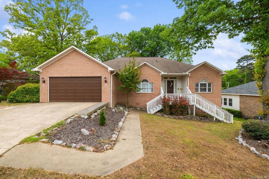 TThis well-maintained brick home offers a spacious and great floor plan perfect for comfortable living and entertaining. Featuring 3 bedrooms, 2 bathrooms, with 14' x 35' bonus room upstairs offering versatility for 4th bedroom, office, game room or gym. The home includes granite countertops in the kitchen, a convenient 2-car garage, a dedicated laundry room, and peaceful sun porch to relax and watch the sunset on Lake Hamilton.  Below the main level, a LARGE workshop offers excellent space for hobbies, projects, or additional storage, along with adjoining unfinished multi-purpose areas ready to be customized to fit your needs whether for a home gym, studio, or extra living space.  Located in the desirable Lake Hamilton School District, this property combines space, flexibility, and potential all in a great location. HOA includes private Boat slip acess on Anderson St.