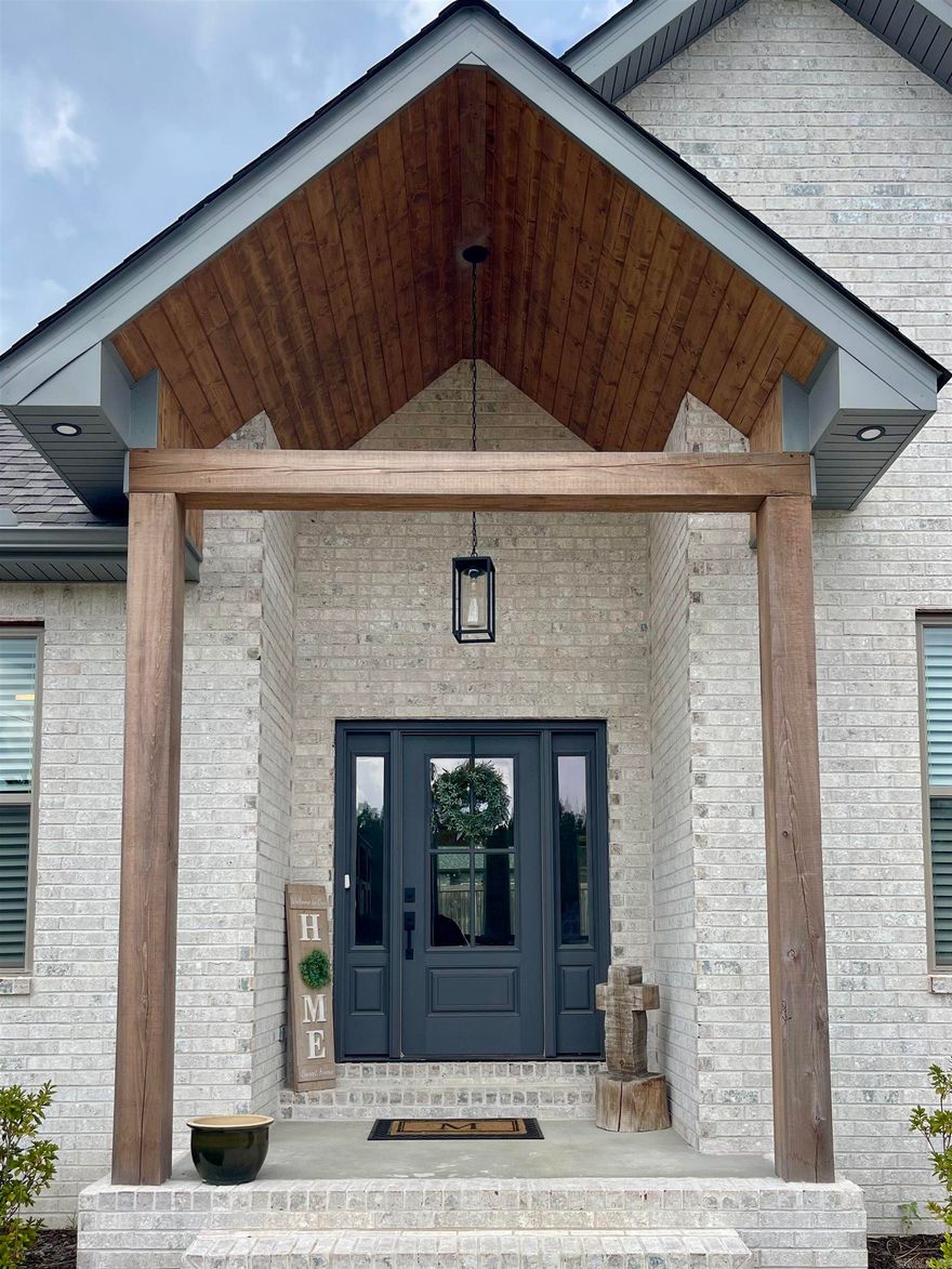 This stunning 4/2 build is located in the desirable JACOB CREEK subdivision.  This all brick home sits on approximately 0.36 of an acre. Inside you'll find a great room that boasts 10' ceilings & is open to both the kitchen & dining area welcoming you & your guests in.  There is an easy & open flow to the gorgeous covered back yard patio w/retractable sun shades, dining area & grilling area.  Back inside the quartz countertops flow from the kitchen into the oversized laundry room filled with built in storage & folding area.  The primary bedroom is a spacious accent to the luxurious spa like primary bath that awaits you.  Bring your favorite drink &  dip your toe in to the soaking tub or enjoy the oversized walk in shower as well as two private walk-in closets. The garage is oversized allowing room for full sized vehicles while providing a space to tinker & store tools in the separate utility room. The driveway holds an addition 4 full sized vehicles with ease when family or friends come over to enjoy the game day porch in the fully privacy fenced back yard.  Inside or out, you're sure to love everything 125 ALLIE JO LANE has to offer.  WELCOME HOME... you're gonna love it here!