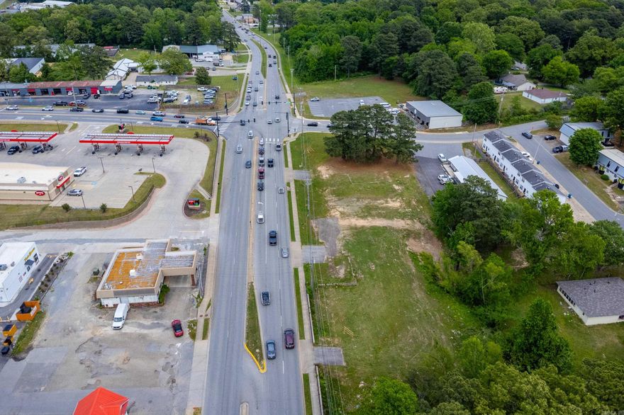 2 acres with 2 houses at the corner of Military and Watts. One of the busiest intersections with Great visibility from I-30. This property has great potential for commercial development, with additional commercial access from Longview.