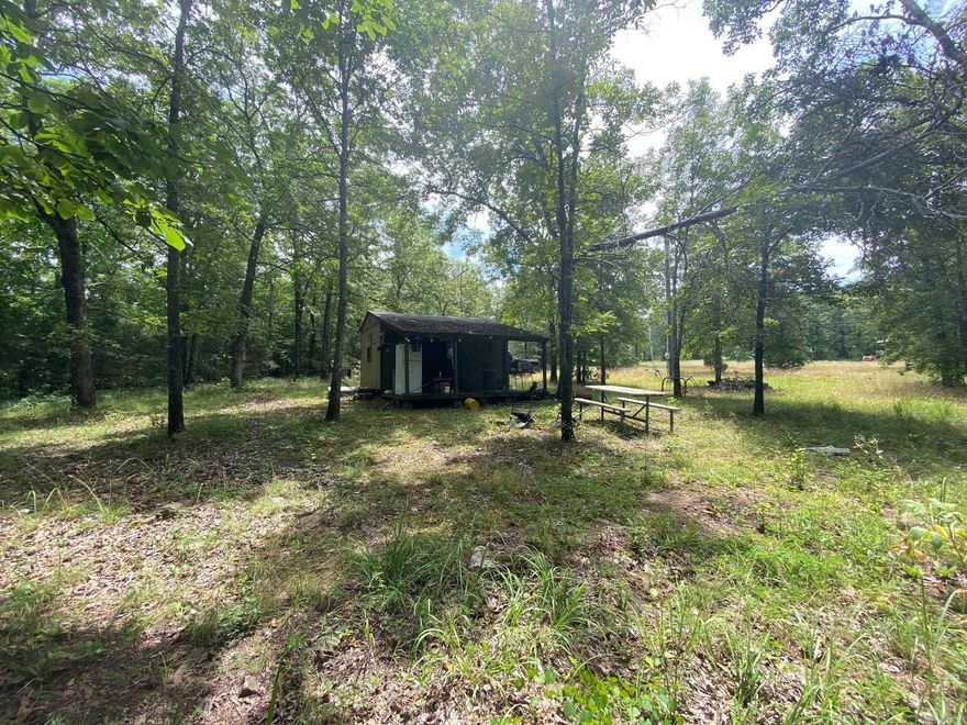 3.5 Acres of prime little red frontage.  Has small cabin, great for trout.  Shared drive easement on file.  Has electricity and used to have water.  Agents see remarks.