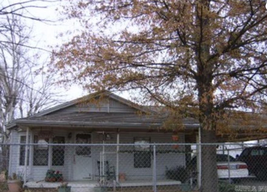 3 bedroom, 1 bath house with shop and 2 storage buildings, fenced yard