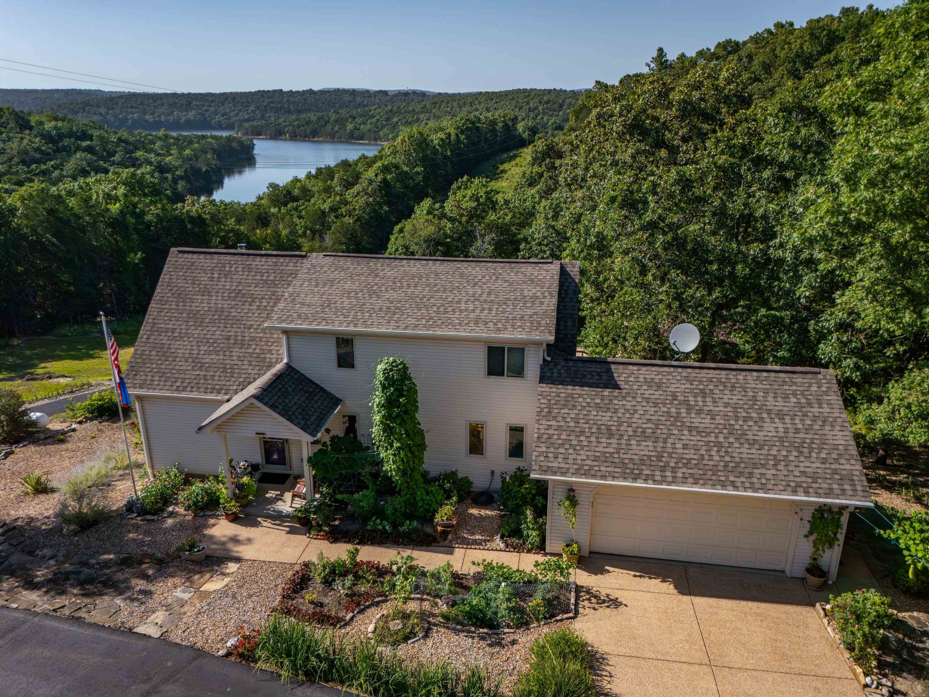 Amazing views of Bull Shoals Lake! This gorgeous home is sitting on 7 acres m/l at the end of the privately owned driveway. Inside you will find amazing views from the main level and the upper level. Primary bedroom is spacious, has a walk-in closet and its own private office/sitting area. This home also features a full basement with its own private kitchen, living space, bedroom and bathroom! If that wasnāt enough to knock your socks off, there is also a detached shop with its own paved driveway leading to it. Plenty of extras with this home, screened porch, central vac system, modern kitchens and bathrooms. Enjoy your own slice of paradise with this one-of-a-kind property. Minutes from White River Access and Bull Shoals Lake Access!