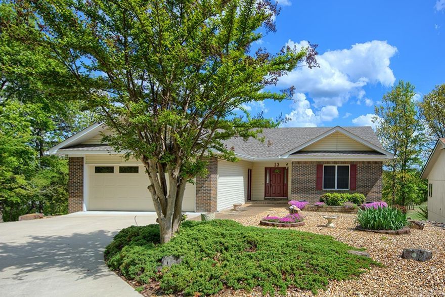 Welcome to this beautiful one-owner golf-front home in Hot Springs Village, overlooking the par 3 12th on Coronado Golf Course. 13 Zaragoza Lane offers scenic golf views, privacy, and a comfortable, inviting layout.  This immaculate 3-bedroom, 2-bath home features an open floor plan filled with natural light from expansive windows showcasing the course. The spacious living area with soaring ceilings flows seamlessly into the dining and kitchen spaces, making it ideal for both everyday living and entertaining.  The kitchen offers ample storage with lots of cabinets, a pantry, and lot of counter space including an island.  The bedrooms are split - the primary suite has two walk in closet with built-ins, and the primary bath has a separate shower, bath and vanities.  A beautiful Arkansas room surrounded by windows provides the perfect space to relax and enjoy year-round elevated views of the golf course setting. There is an large garage with workspace as well as a heated & cooled workshop downstairs.   Enjoy peaceful mornings and evenings overlooking the golf course or strolling through the beautiful landscaping.