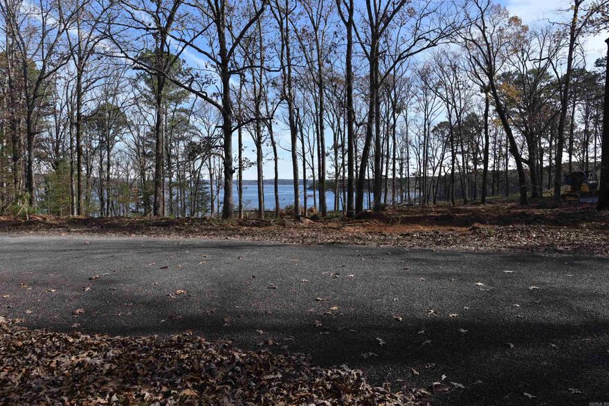Beautiful Lakeview Lot across the street from the Lake.  This lot is a nice level lot to build on.  A boat slip nearby is available to purchase for $35,000. Imagine waking each morning to breathtaking water views & enjoying the peace & privacy this unmatched location offers.  Underground Utilities: Seamless, modern infrastructure for power & fiber internet.  Enjoy All Fairfield Bay Has to Offer: Championship Golf: Two 18-hole courses just minutes away. Active Lifestyle: Pickleball, tennis courts, and more than 80 miles of ATV/UTV trails. Full-Service Marina, Swim, hike, bike, & so much more. Fairfield Bay truly is a slice of paradise! Build your forever home or a serene getaway in a welcoming, upscale neighborhood. This is your chance to experience qualify living at its finest—where tranquility & recreation meet luxury and convenience. Paradise is calling.
