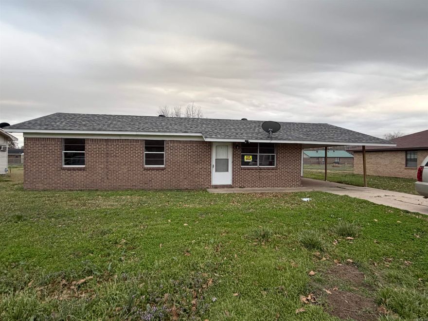 Three bedroom, one bath brick home with carport. Roof is approximately 3 years.