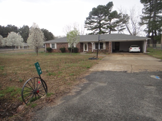 Beautiful brick home in the outskirts of Searcy. Sits on nice 1 acre lot with back portion fully fenced. Plenty of room for a garden. 3BR/2BA has carpet and vinyl floors. Spacious kitchen with gas stove. Large laundry area. Nice size bedrooms. Master Bath has walk-in shower. New HVAC Furnace. Large storage building with electricity and concrete floors and additional covered storage area. Covered parking area. Enjoy the country view from your screened-in back patio.