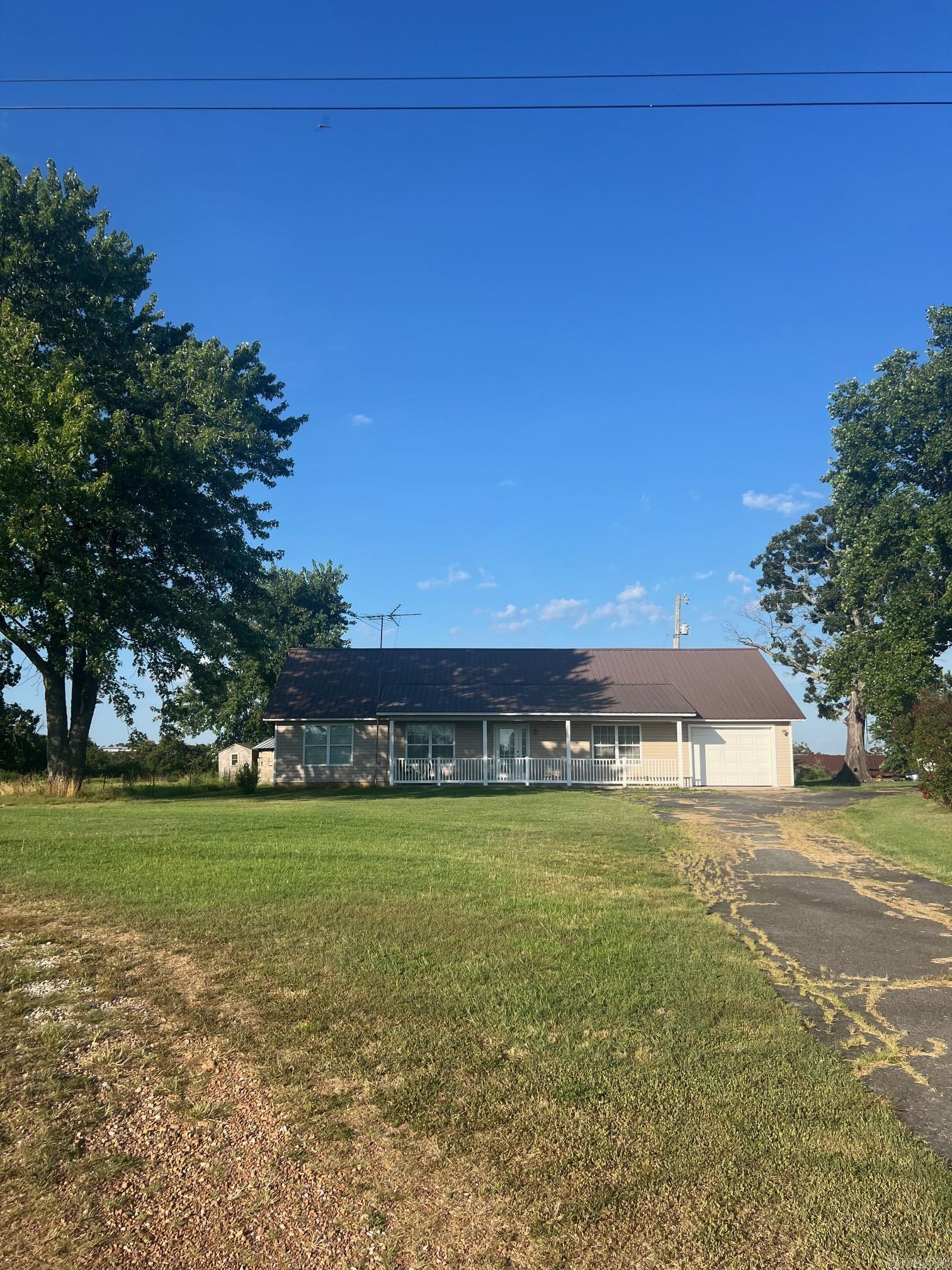 What a perfect home in the middle of the peaceful town of Prim, Arkansas. This home features an open floor plan with wide doorways and halls, low thresholds for easy access for a wheelchair or walkers. Beautiful country setting with large shade trees, garden spot and plenty or outdoor area for children, pets or entertaining. Just minutes from the Greers Ferry Lake, Mountain View, the White River and the beautiful Ozark Mountains.