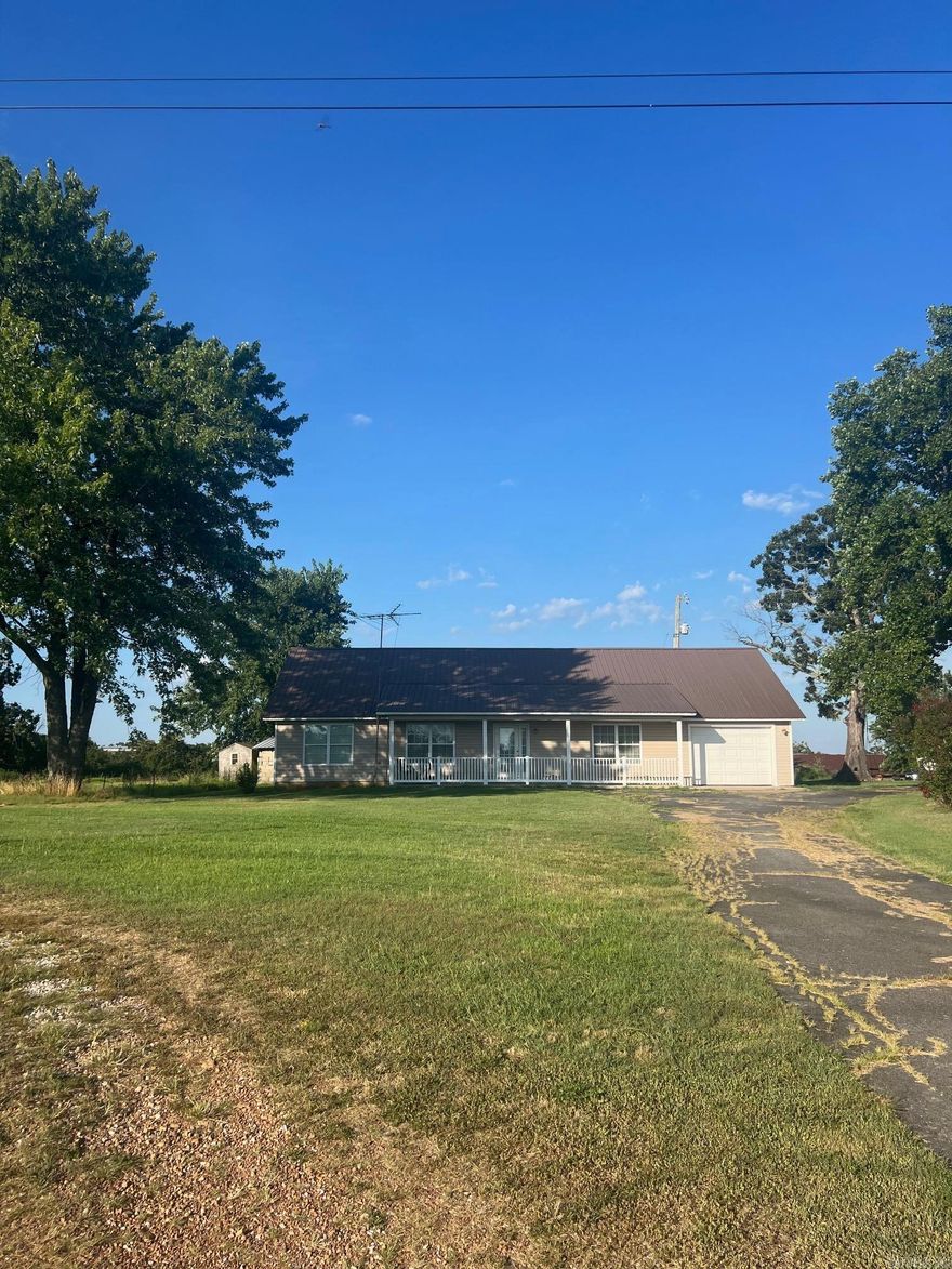 What a perfect home in the middle of the peaceful town of Prim, Arkansas.  This home features an open floor plan with wide doorways and halls, low thresholds for easy access for a wheelchair or walkers.  Beautiful country setting with large shade trees, garden spot and plenty or outdoor area for children, pets or entertaining. Just minutes from the Greers Ferry Lake, Mountain View, the White River and the beautiful Ozark Mountains.