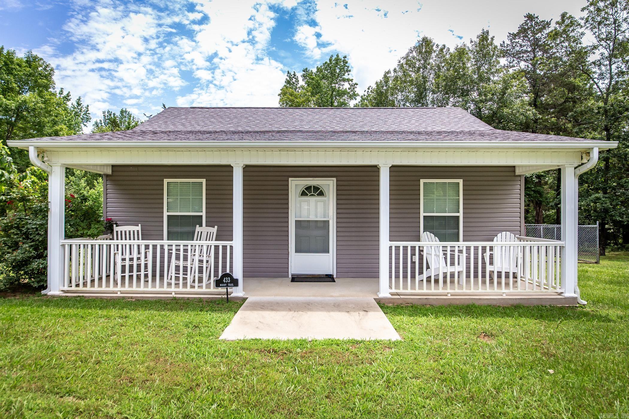 Welcome to your dream home, just 5 minutes from Greers Ferry Lake! This newer construction home beautifully combines comfort and convenience. Begin your outdoor adventures with a spacious storage building, perfect for all your lake toys. Enjoy serene mornings and evenings on the great screened-in porch, or host the ultimate barbecue on the expansive patio. Situated on a large corner lot, this one-level home boasts a quiet street and wonderful neighbors. Step inside to find a stunning walk-in master shower that is truly to die for. The home can even be sold furnished, making your move-in a breeze. With vinyl siding and stained concrete floors, this home requires minimal upkeep. The nicely maintained yard and partially fenced backyard provide a safe haven for your children or pets. Don't miss this low-maintenance gem with endless opportunities for outdoor enjoyment! Ready to make this tranquil retreat your own? Schedule a showing today!