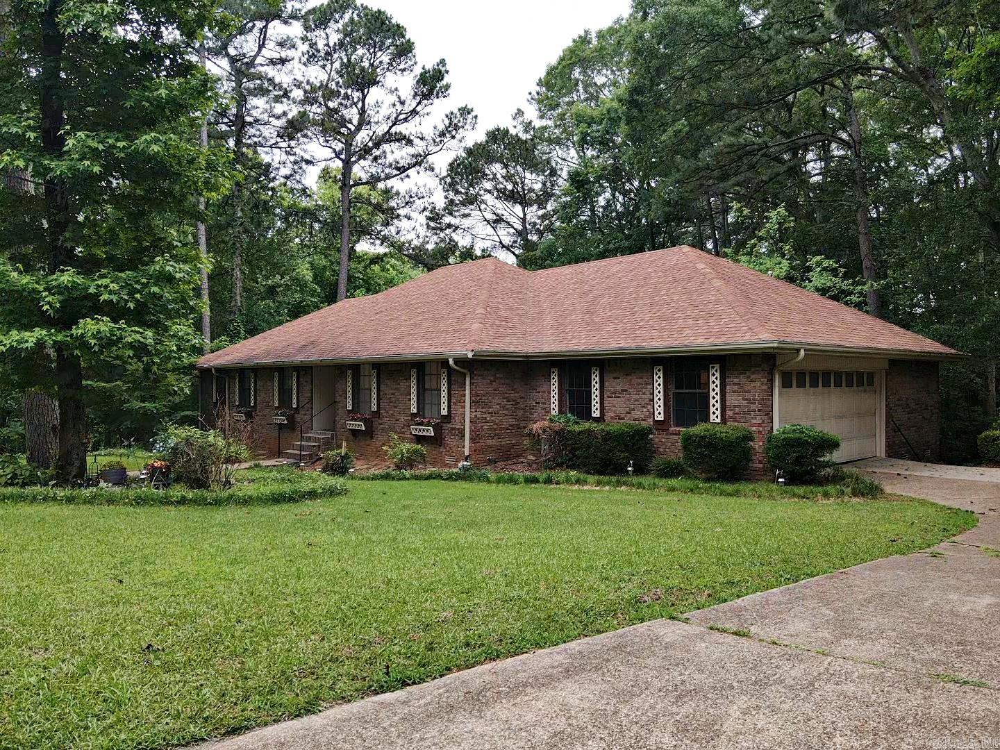 Spacious home sitting on corner lot with mature trees. The main level of this home has 3 bedrooms, 2 baths, formal living room, den/family room, kitchen, laundry and 2 bay garage. Downstairs consists of 3 additional bedrooms, 1 bath, kitchen and living room with 1 bay garage. Perfect home for a large family needing space, in-law quarters or rental income.