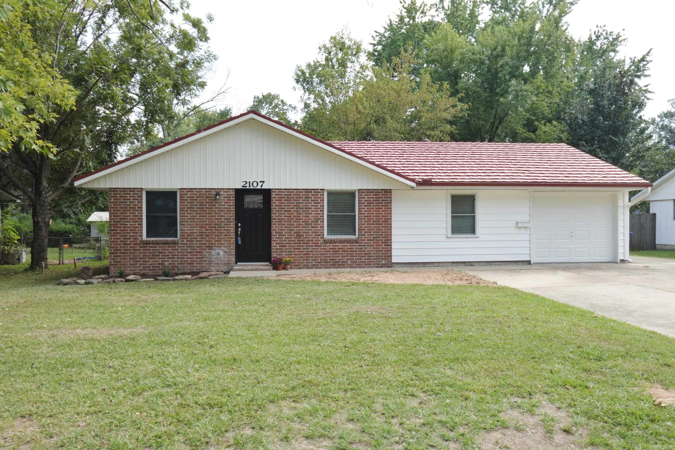 Cute brick & vinyl 3BR/2BA home w/1 car garage w/extra parking COMPLETELY REMODELED!! Taken to the studs (over 40 sheets of new sheetrock installed) & walls removed to make an open floor plan. Split BR plan w/new primary BR & BA w/ a large walk-in closet. Primary bath completely gutted & new tile shower installed. Kitchen gutted & all new cabinets, appliances & water line installed for refrig., new sink, new disposal, all new plumbing & new granite countertops w/ subway tile. Other updates include: All new luxury vinyl flooring throughout the entire house, baseboards all new, new wiring to all lighting, new receptacles switches, HVAC cleaned, serviced w/ new plenum, new ducts and vents, GFCI's installed in kitchen & BA's, In hall bath everything was replaced but the tub including plumbing pipes and sewer pipes (in both baths), exterior door added in garage w/ new cellulose insulation in the attic, Ext. of home has been primed & painted, new ext. faucets, landscape added, topsoil added to fill in holes & fishpond in back., new deck in the backyard, new window blinds throughout, new doorbell, new water heater. The roof is an aluminum shake roof that has been cleaned. fenced yard.