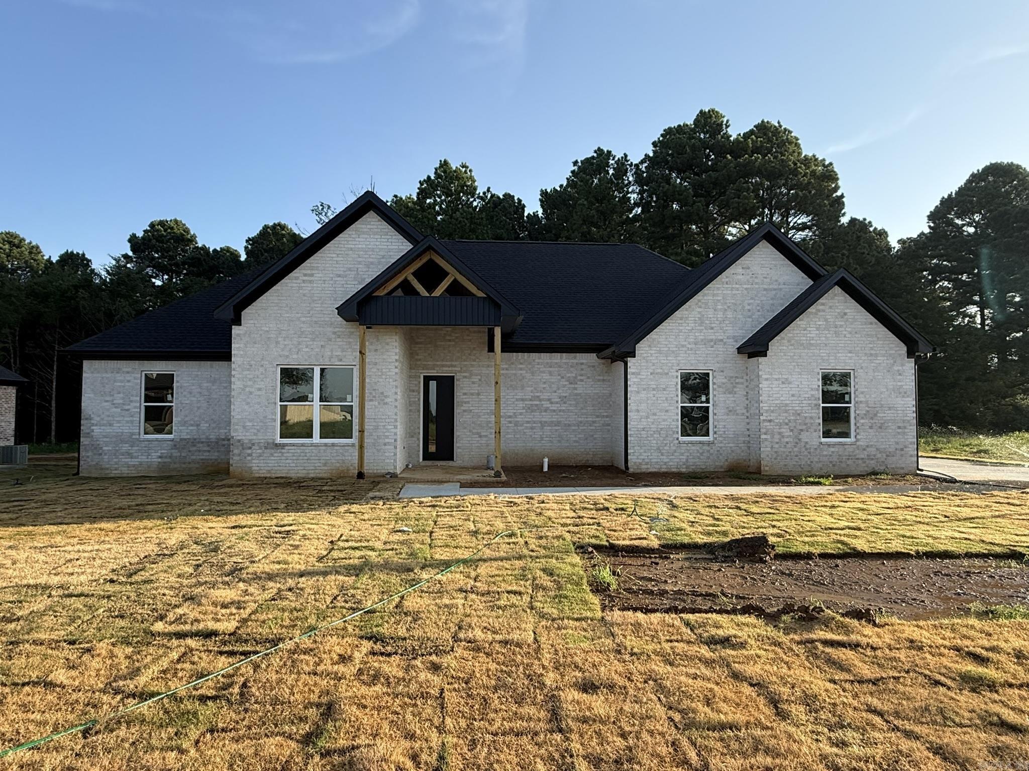 Located in the prestigious Belmont Estates and just minutes from Searcy Country Club, this stunning new construction home is nearly complete and offers over 2,200 square feet of modern elegance. Designed with an open floor plan and tall ceilings, the home features spacious, light-filled rooms, a modern fireplace in both the living area and the luxurious master suite, and a chefās kitchen with top-of-the-line appliances and sleek cabinetry. The master suite boasts a spa-like bathroom with dual vanities, a walk-in tile shower, and a large walk-in closet, while the mudroom adds convenience and organization to your daily routine. A spacious garage provides ample room for vehicles and storage. With its clean modern design, premium finishes, and move-in availability just around the corner, this home is perfect for those seeking luxury, comfort, and location. Donāt miss your chance to make this incredible home your ownācontact us today for more information!