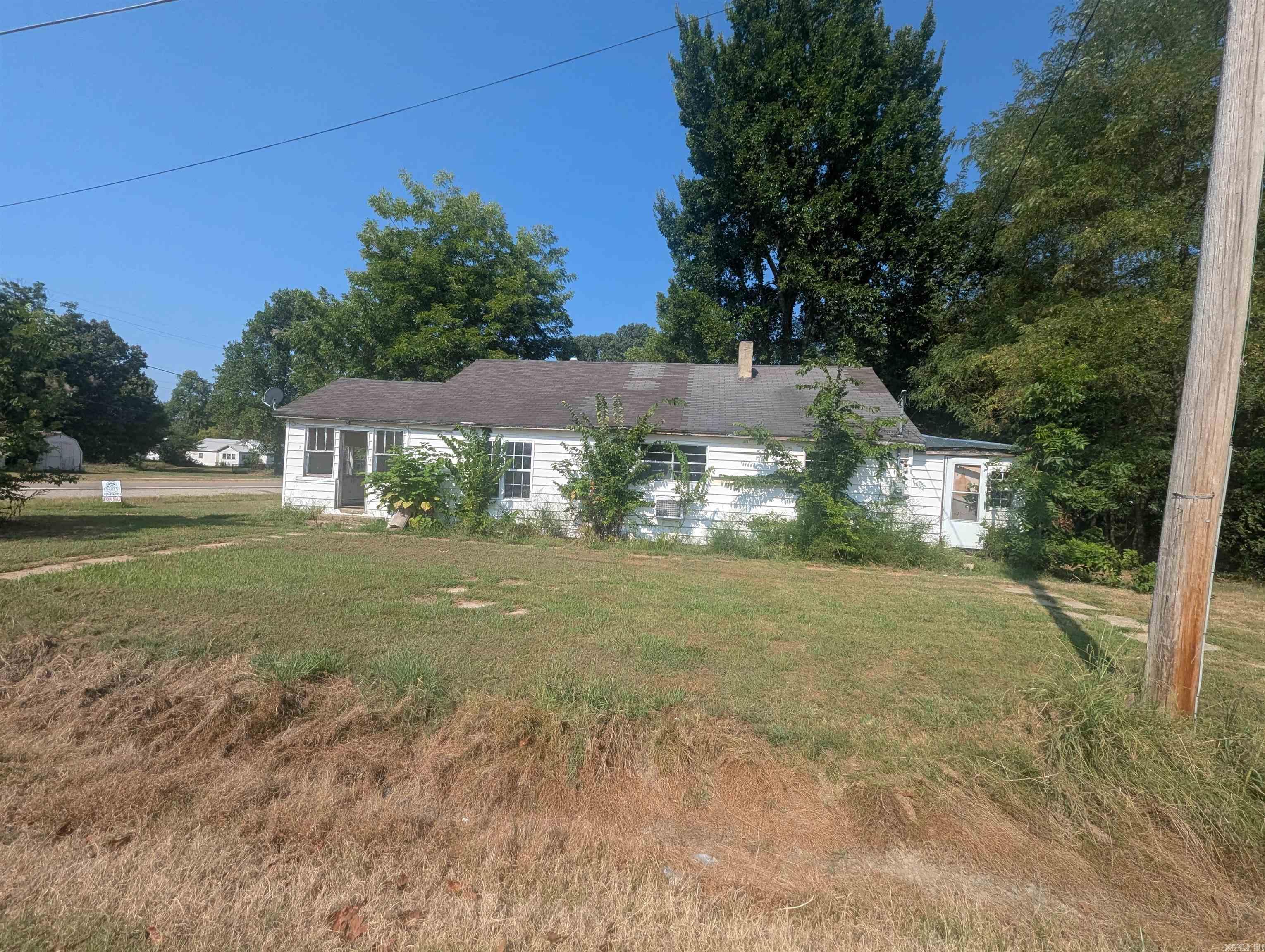 This charming is a great opportunity for anyone looking for an affordable home to transfer into their very own! This home features a simple design, a spacious yard surrounded by mature trees and concrete storage building. There are already some updates throughout!