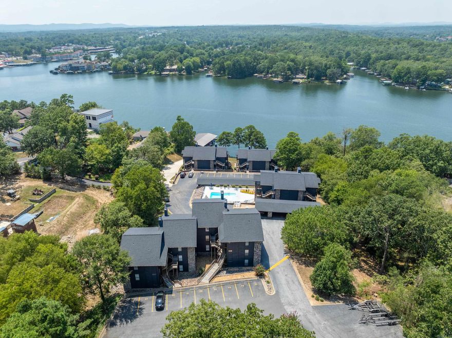 This furnished, 3 bedroom, 2 bath condo off Hwy 70 West offers a sought after ground-level, walk-in entry with stunning main channel views of Lake Hamilton. The property includes a covered boat slip and offers the flexibility of short term rentals, making it an excellent investment, vacation retreat, or full time residence. Enjoy the convenience of covered parking, additional parking by the front door, and two outdoor storage rooms. The gated complex features a pool, tennis court, and is ideally located near restaurants and the bypass. This is lakeside living at it's finest!