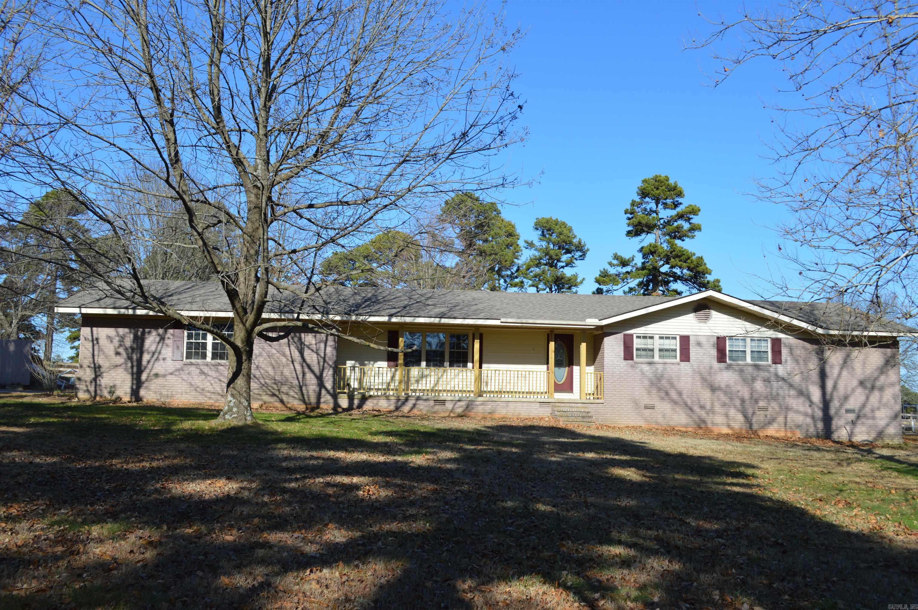 Country Living...located in Ida, which is between Heber Springs and Drasco and just minutes from Greers Ferry Lake and Little Red River. Home offers plenty of room for family and friends. Living room has built in book shelves and kitchen offers pull out cabinet drawers. Primary bath has double sinks and tall custom cabinets. Sunroom in back with a skylight, cooled by a window unit. Back yard did have a swimming pool but pool has been removed. Nice large deck for entertaining. Garage has lots of storage closets, access to back yard. Seller could possibly work out a deal with the neighbor for the storage building.