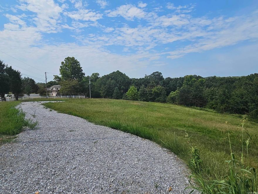 Over 4 Beautiful Acres and ready to build your dream home in a peaceful subdivision with lots of space to grow and play. The property is completely fenced and has a gravel driveway in place. Located just minutes to the Pine Hills Golf Course and your local Wal-Mart. Some Utilities are available at road.  Drive by and check out this property today.