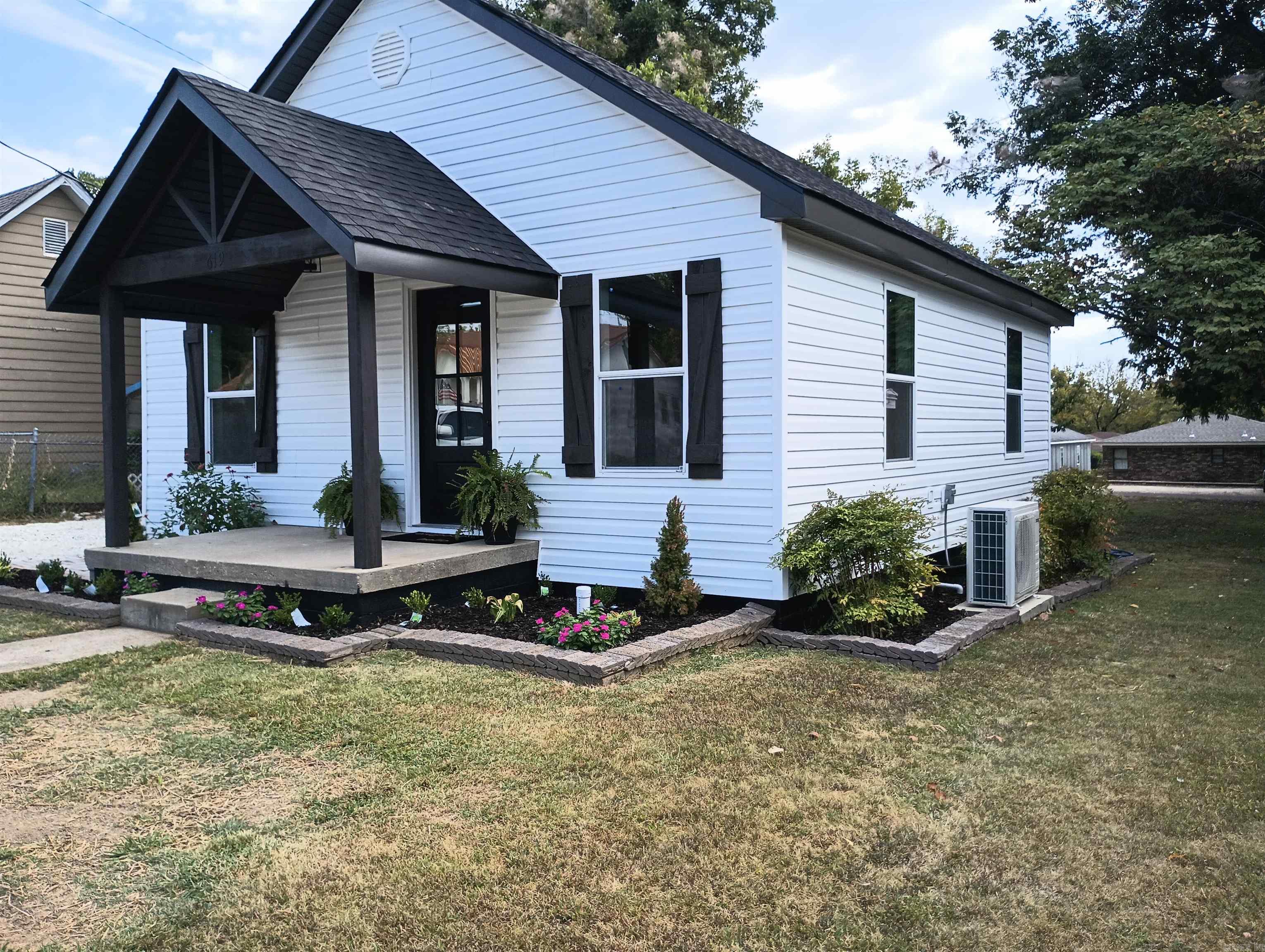 TOTAL REMODELED DOWN TO THE STUDS! Beautiful 2 Bedroom, 2 Bath All Electric home features New vinyl siding w/vapor barrier, Shingles, WDS, interior & exterior doors, sheetrock, insulation, subflooring, electrical, plumbing & drains, Split Unit HVAC, Custom cabinets w/soft close hdwr, electric FP, granite countertops, and Luxury plank flooring. Barn style wood storage building w/new shingles & paint, detached carport, large backyard and alley access an added plus. New termite contract and property corners marked. SEE AGENT REMARKS!