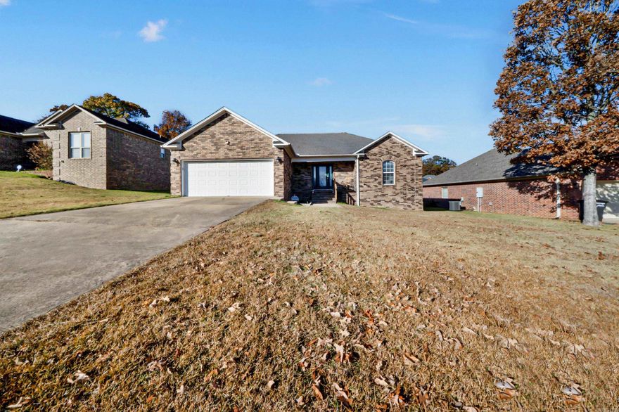 Close to Little Rock AFB! This gorgeous all-brick home offers an inviting great room with beautiful hardwood floors, tall ceilings, and a cozy fireplace. The stunning kitchen features granite countertops, a center island, and a spacious breakfast area with custom built-ins, perfect for everyday living and entertaining. The split master suite boasts tray ceilings, dual vanities, and an oversized walk-in closet. Secondary bedrooms are generously sized as well. Enjoy a charming front porch with iron railings and a nice back deck ideal for gatherings. Situated on a lovely lot in the highly sought-after Base Meadows community!