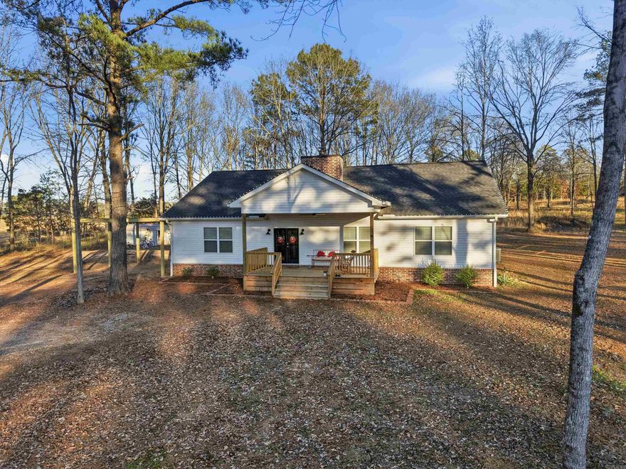 Located in the community of Bigelow, this 4 bed, 2 bath home sits on 2.5+ acres and offers privacy, space, and breathing room — all while being less than 10 minutes from Walmart and the heart of West Conway.  Built in March 2024, this 4-home has an open-concept layout designed for everyday life. The living room centers around a brick fireplace that naturally draws people together, whether you’re hosting or winding down at the end of the day. The kitchen and bathrooms feature granite countertops and clean, modern finishes. The primary suite includes a spacious bedroom, two walk-in closets, and a bathroom with a standalone tub, walk-in shower, and double vanities. Each additional bedroom also includes great closets, giving everyone their own space. Outside, a large front porch and covered back patio create multiple areas to enjoy the outdoors — from morning coffee to evening gatherings. With acreage like this, there’s room for hobbies, animals, gardens, or simply enjoying wide-open views and quiet surroundings. If you’ve been searching for space without sacrificing access to everyday needs, this one deserves a closer look.