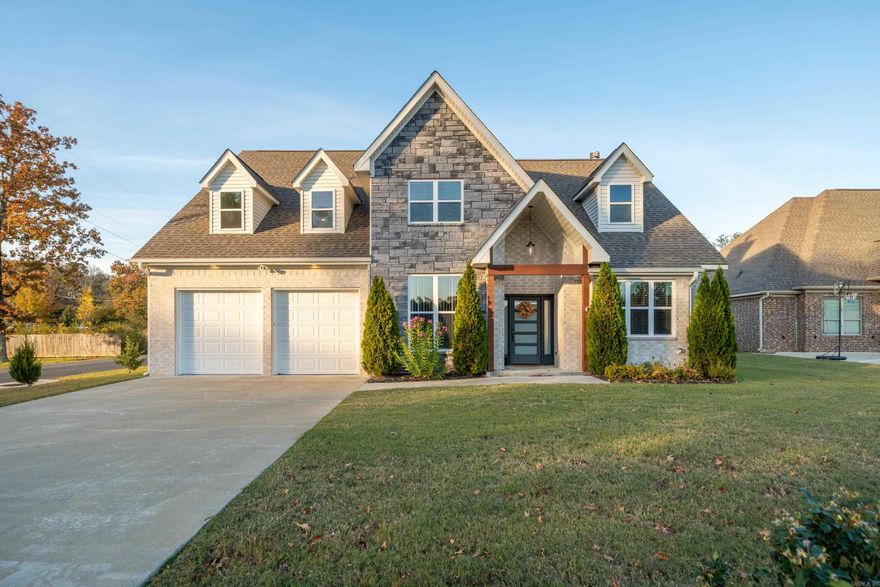 Imagine waking up in a beautifully maintained 5B/2.5B home that blends comfort, style, and smart living—where mornings start in a sunlit kitchen with double ovens, a gas cooktop, and a smart fridge that keeps you on track. Evenings are spent relaxing by the fireplace or hosting movie nights in the oversized upstairs flex room. The primary suite offers a true retreat with a jetted tub, walk-in shower, double vanity, and a spacious closet. An EV-ready 2-car garage, mudroom, smart lighting, and whole-home integration make daily life effortless. Outside, the huge fenced yard is perfect for weekend gatherings. Located minutes from Oaklawn and downtown Hot Springs - plus no HOA - this home delivers convenience, privacy, and modern luxury all in one.