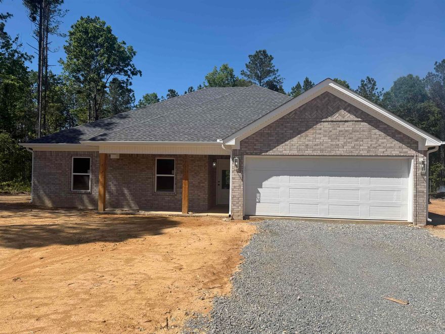 Welcome to 864 Grant 58!! This beautiful all brick home is situated on 2.23 acres and features 4 bedrooms and 2 bathrooms! When you walk inside you'll find an open split floor plan with luxury vinyl plank flooring throughout the whole house! Cozy gas fireplace, stainless steel appliances in the kitchen with a gas stove. You'll also find a spacious primary that flows into the bathroom with a tile walk-in shower, soaking tub, his and her vanities, and large walk- in closet! When you step in the backyard you'll  find the spacious back patio overlooking peaceful wooded views! You don't want to miss this one!! Schedule your showing today!!