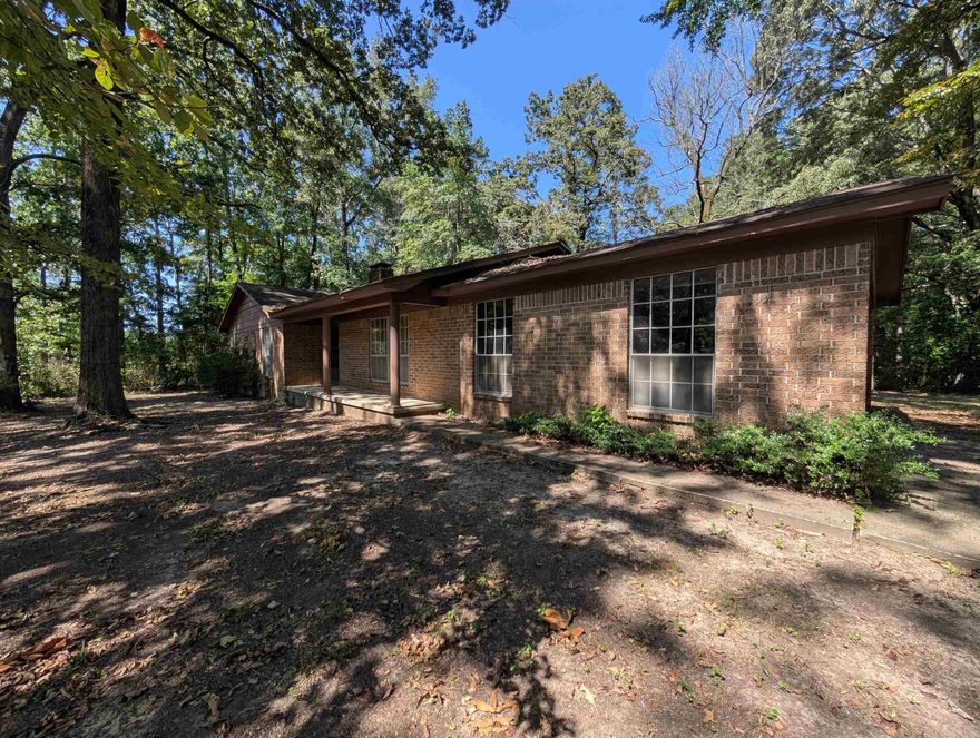 One owner home on 1.5 acres.  This 3 bedroom 2 bath house is all brick, with a small shop.