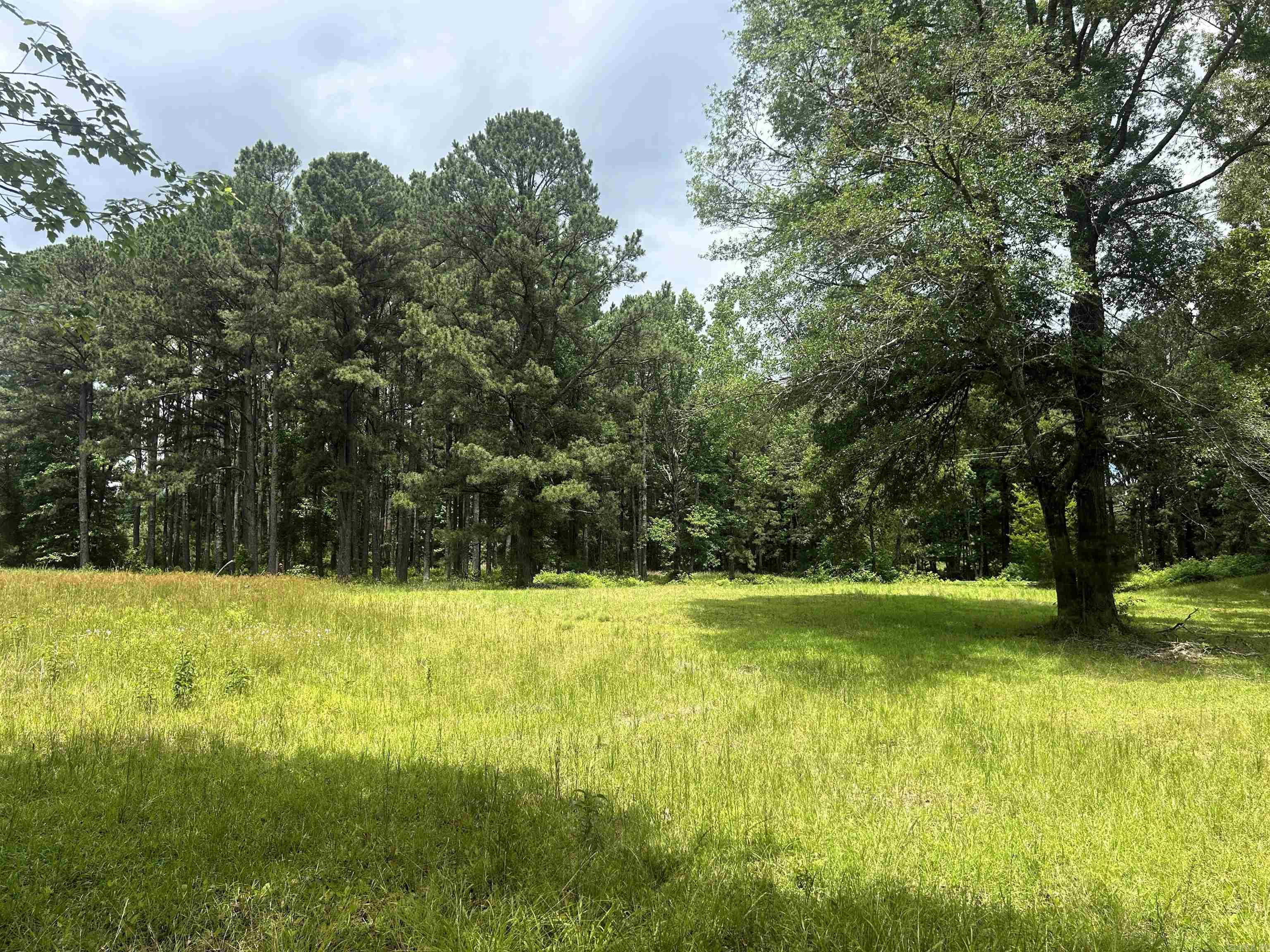 This tract features over four and a half acres including cleared pastureland, small pole barn and a sizeable pond*no restrictions*natural gas and water meter hook ups on the land*current survey and preliminary perc letter.