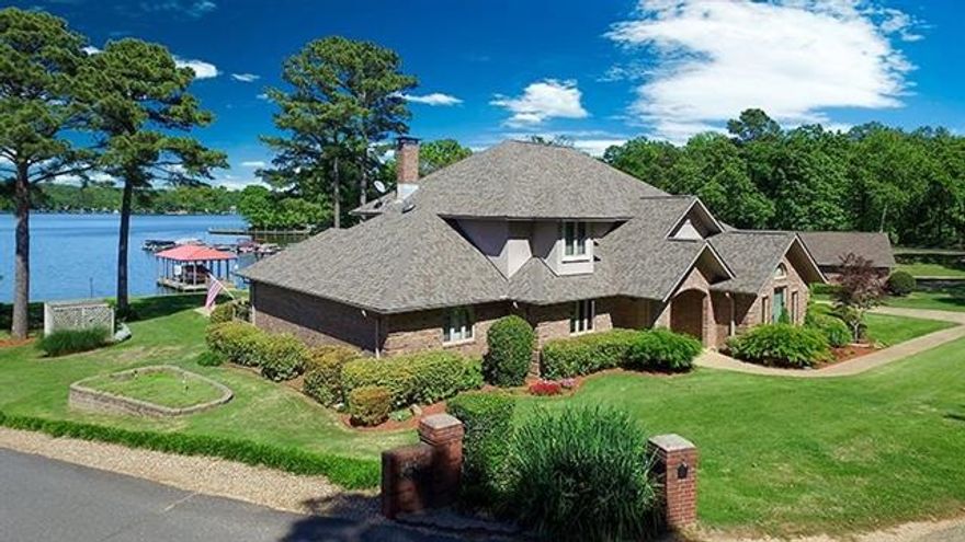 Lakefront Serenity....Unspoiled...Unchanging...Unequaled.  Little compares to the scenic community of Farr Shores.  Overlooking one of Hot Springs picture-postcard lakes, this spectacular waterfront retreat offers a gourmet kitchen, with top of the line appliances and extensive counters in slab granite.  Soaring ceilings, warm family room and a romantic master suite are just some of the highlights.  The resort like back yard offers an in ground swimming pool, private boat dock with a lift!