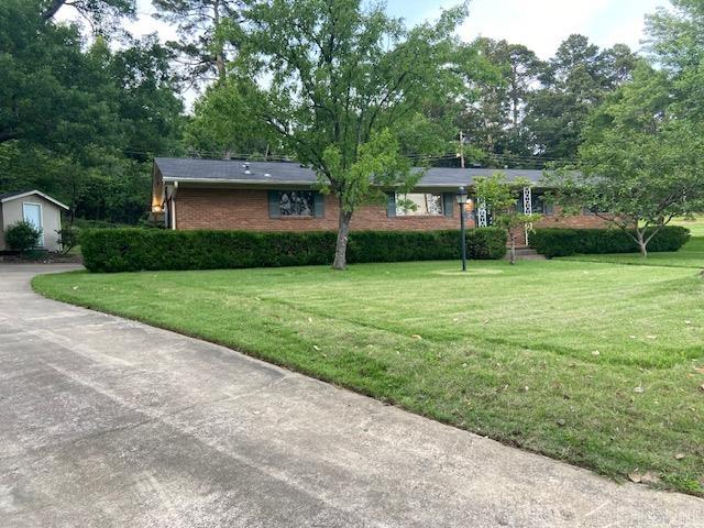 One level, all brick, side loading private carport. Private back yard., with a storage shed. In a cul-de-sac with only 5 other houses. Convenient to everything. Fresh paint throughout and wood laminate floors. Kitchen, dining, great room, sunroom all light and open. Fireplace with bookshelves on each side. Wood shutters on all the windows. Two sliding glass doors for easy access to the back yard. Doggie door w/private fenced area from the sunroom. Kitchen includes granite countertops, smooth, countertop electric stove, stainless electric wall oven, beautiful wood cabinets, an amazing laundry room w/tons of cabinets and storage. Closets everywhere. New, modern light fixtures and ceiling fans. Utility bills are unbelievably cheap. This is a doll house. Come see.