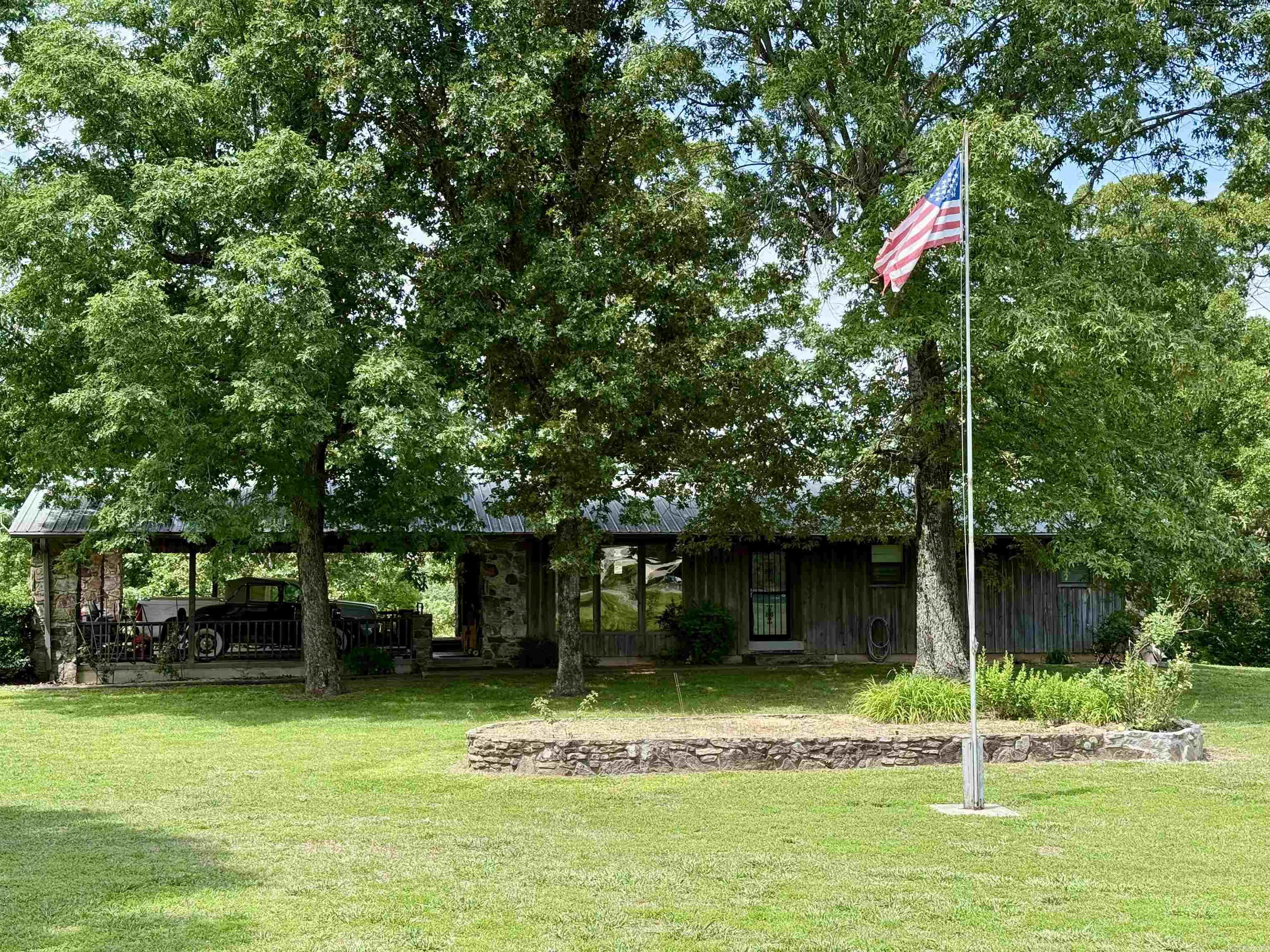 Discover your own rural retreat at 4403 Highway 63, Mammoth Spring, AR. Sitting on approximately 23 acres with 1,292 sq ft of ranch-style living, this 3 bed/1.5 bath home includes central HVAC, attached 2-car carport, and large basement. Outside, enjoy a private pond, mature trees, and multiple outbuildings— including a large in 60’×30’ shop, workshop, barn, old home place and storage areas—perfect for livestock, equipment, or home-based business. With approx. 1,300 ft of highway frontage just minutes from Spring River, this versatile property offers peace, privacy, and investment potential. Sold in “as-is” condition. Auction scheduled for Sunday, July 13th @ 3pm (online) at SOLDasap.com. Don’t miss this rare rural opportunity! SOLD IN 2 TRACTS, Buy 1 tract or buy them all! The choice is yours!