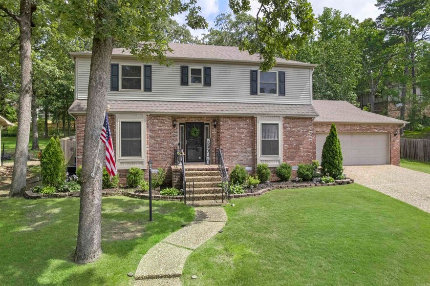 Step into your dream home in the heart of Little Rock, where thoughtful design meets everyday luxury. This stunning 4-bdrm, 2.5-bath residence is nestled in a desirable neighborhood, offering a perfect balance of comfort, style and privacy with its split-bedroom layout. Walk in the beautifully appointed gourmet kitchen, complete with stainless steel appliances, a modern gas stove, and a spacious island. Custom cabinetry adds smart storage with pull-out spice drawers, sheet pan and cutting board organizers, even an under-sink pullout tray. The living area is warm and inviting, centered around a cozy gas fireplace with built-in adjustable bookcases—ideal for relaxing evenings. Designed for year-round comfort, HVAC system, with the upstairs unit replaced in 2022, downstairs unit updated Dec. 2024. New stove & water heater in 2025. Step outside to enjoy an impressive outdoor retreat. The expansive backyard offers endless possibilities for kids, pets, and outdoor fun. Featuring a multi-tiered deck,  and a concrete basketball court. A storage building, a fenced yard with 3 gates to ensures privacy. This rare home blends style, function, and space just for you. Book a showing today!