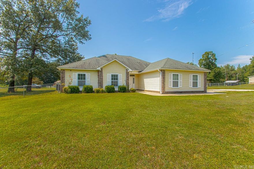 Lots of great space inside AND out with this one!  Sitting on a large (almost an acre) lot, this house offers plenty of room to spread out!  The yard is fully fenced, and the 11.5' x 16' shop has electricity and is heated & cooled! Inside, the great room is huge, is open to the kitchen and features a fireplace that can use propane gas logs or could be wood burning!  The kitchen features an abundance of beautiful cabinets, granite countertops, and a pantry!  The Primary Suite is apart from the other two bedrooms.  It features his/her closets, a jetted tub, a walk-in shower, and a double vanity!  Laundry room with cabinets, a 2 car, side-entry garage, and so much more! Agents see remarks.
