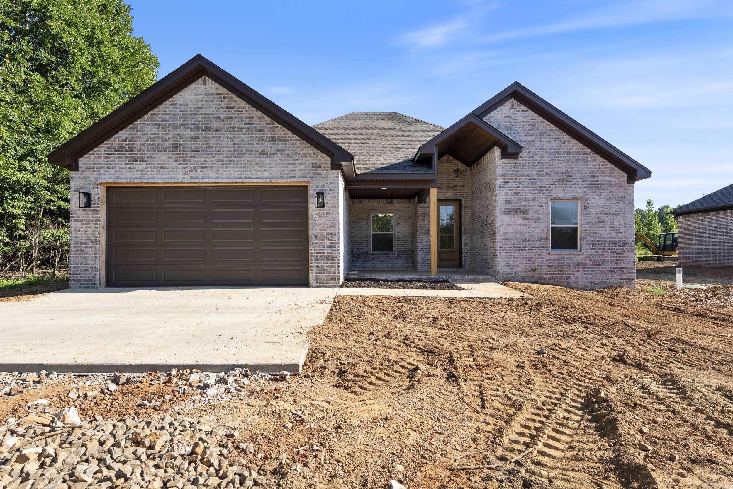 This brand-new all-brick home combines quality craftsmanship with timeless comfort. Featuring 3 bedrooms, 2 bathrooms, and 1,800 square feet of open living space, it sits on nearly an acre of landāoffering both privacy and room to grow. The open floor plan flows beautifully, and the wood-burning fireplace brings warmth and charm to the heart of the home. Outside, a spacious sitting porch invites you to slow down and enjoy the peaceful surroundings. If you're looking for a move-in-ready home with space, character, and classic style, this one has it all.