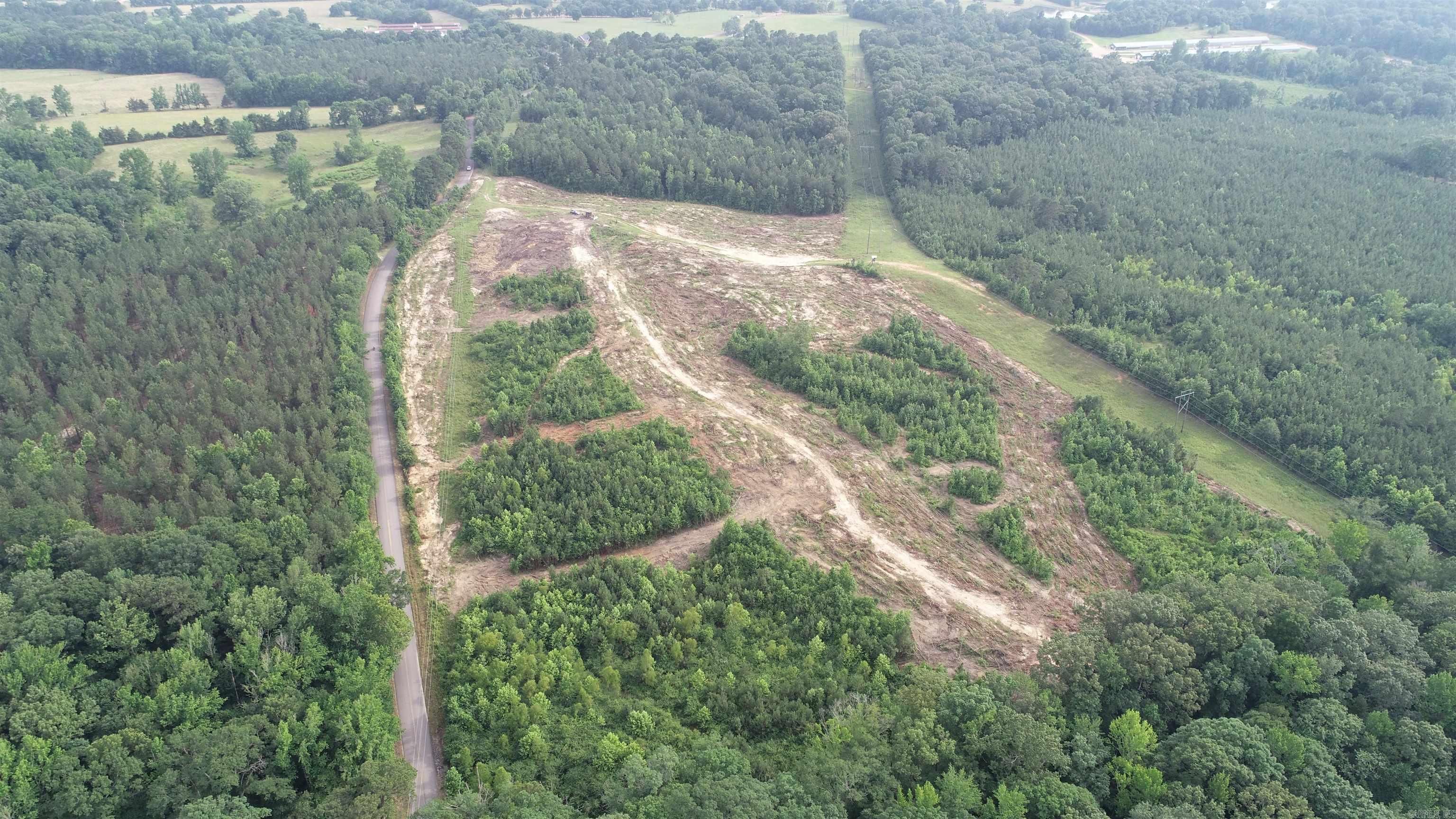 This recently cleared land is now available for homesites. Tract 3 is approximately 7.5 acres and offers multiple spots to build a home in a private country setting that is only 2 miles from the Main Street of Dierks, Ar. Water and electricity are available along the highway.
