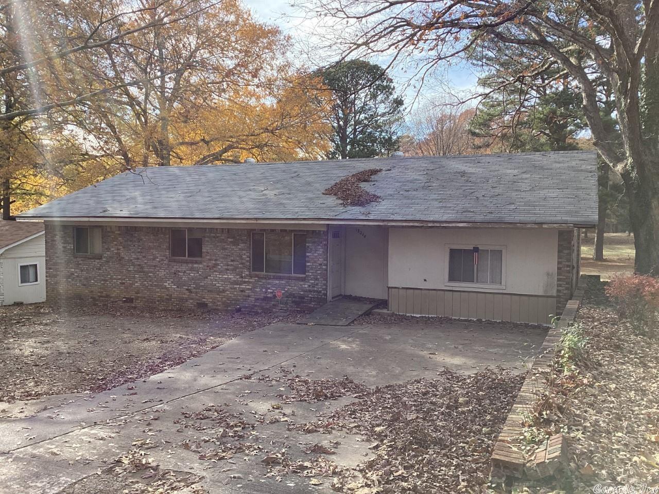 This home is on Chicot Rd - needs work. Has a downstairs basement with a full bathroom and access to the outside. Forth bedroom has the washer and dryer connection.