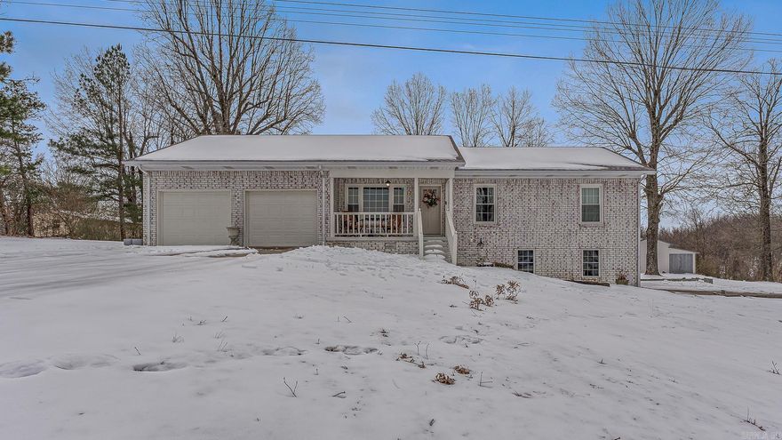 This beautifully remodeled home offers the perfect blend of modern updates and spacious living. Featuring 5 bedrooms and 3 bathrooms, it provides plenty of room for families to grow and entertain. Inside, you’ll find fresh paint, all-new flooring and carpet, stylish finishes, and a thoughtful layout with two living areas. The updated kitchen showcases solid surface countertops, new appliances, a tile backsplash, and flows seamlessly into the dining area—perfect for gatherings. A cozy gas fireplace adds warmth and charm.  Additional interior highlights include large bedrooms with generous closet space, a convenient downstairs laundry room, and abundant storage throughout. Outside, enjoy 2.1 acres with plenty of space to relax, play, or work. The two-car garage and additional outbuilding/workshop provide excellent storage and workspace.  Major improvements include a new roof in 2020 and much more.