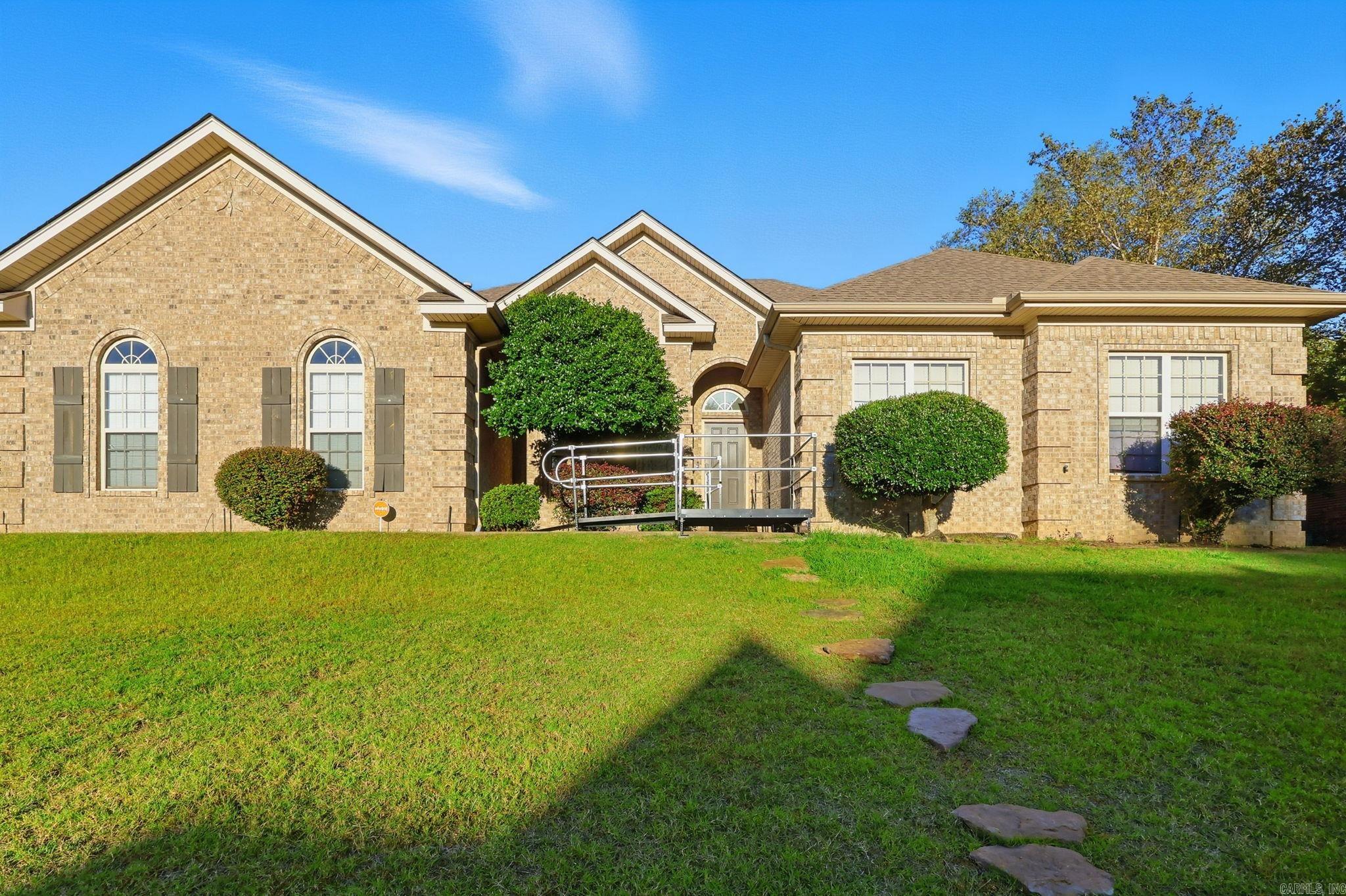 Welcome to 107 Hidden Falls Lane in beautiful Maumelle, Arkansas! This stunning 4-bedroom, 3-bath home with a private office space offers the perfect blend of comfort, style, and functionality. The open-concept floor plan is ideal for entertaining, with spacious living areas filled with natural light and modern finishes throughout.  Sitting proudly on a large corner lot, the property provides ample outdoor space for family fun, gardening, or relaxing evenings under the stars.  Located in a highly desirable community, residents enjoy exceptional amenities including a sparkling swimming pool, tennis courts, playground, clubhouse, golf course, and fitness and bike trails, all designed to enhance your active lifestyle.  From cozy family gatherings to quiet work-from-home days, this home offers versatility and luxury in every corner. Experience the perfect balance of elegance, convenience, and community living a place where every detail feels like home.