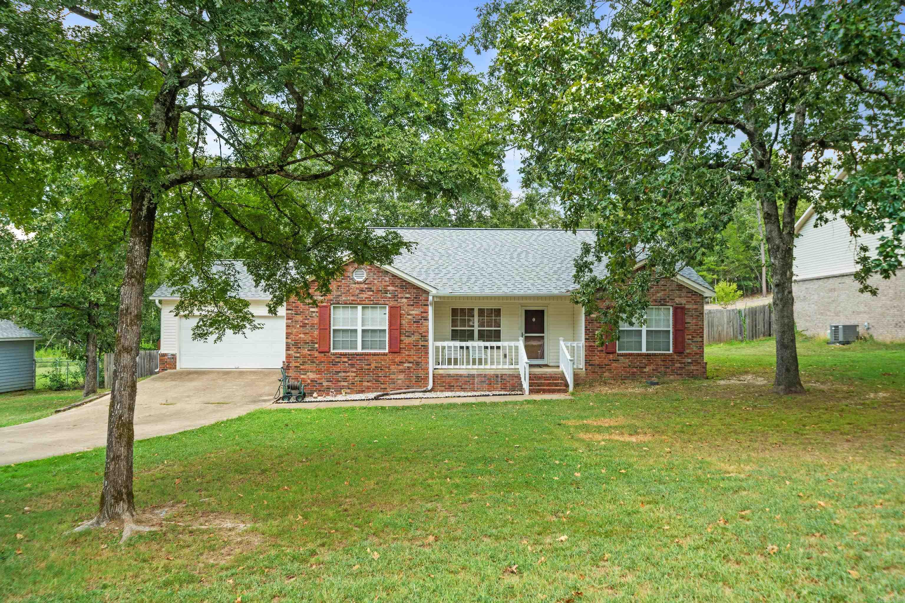 Discover your perfect retreat on this peaceful dead-end street where tranquility meets convenience. This charming 3 Br., 2 Ba. home offers 1,585 sq. ft. of thoughtfully designed living space featuring a practical split floor plan that provides privacy & functionality for modern living. Step inside to find well-appointed rooms that flow seamlessly together, creating an inviting atmosphere for both daily life and entertaining. The primary bedroom enjoys its own private section, while two additional bedrooms offer flexibility for family, guests, or a home office. Outside, your private fenced backyard becomes your personal sanctuary ā perfect for morning coffee, weekend barbecues, or simply watching the world slow down. Recent updates include a roof that's only two years old, giving you peace of mind for years to come. The quiet location means you can actually hear birds chirping instead of traffic humming, yet you're still conveniently connected to local amenities. This home strikes that sweet spot between serenity and accessibility, offering the best of both worlds in Hot Springs living.