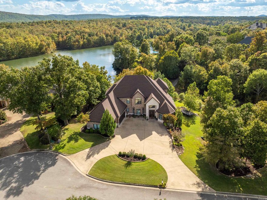 Discover unparalleled luxury in this grand three-story estate, located in the gated community of Red Oak Ridge. Overlooking Red Oak Lake, this stately 6 bedroom, 8 bath home offers over 8,000 square feet of refined living space. As you enter, you are greeted by a grand foyer with soaring ceilings, leading to an expansive living area, ideal for both intimate gatherings and large-scale entertaining. The heart of the home is the chef’s kitchen, fully equipped with high-end stainless-steel appliances, custom cabinetry, a large islands, & a spacious walk-in pantry. This gourmet space is designed for both casual family meals and culinary masterpieces. Adjacent to the kitchen is the dining room with a cozy dining area with a fireplace, all offering stunning lake views through oversized windows. Each bedroom is a luxurious retreat, complete with en-suite bathrooms, walk-in closets, & custom finishes. The primary suite is a true sanctuary with its spa-like bathroom. Every floor of this home offers unique features such as multiple living spaces, private offices, decks & patios overlooking the lake & the beautiful landscaping. Don't miss out on this beauty, schedule your private tour today!