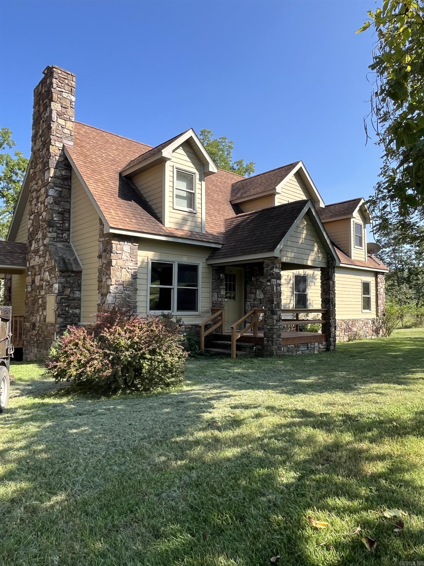 Motivated Sellers!! Enjoy the peace and quiet from this amazing custom built home. This 5 bed, 3 bath home sits on over 6.5 park like acres. The land lays well and boast approximately 4 fenced acres for livestock or hay as well as 2 ponds and a small creek in the back yard. There is also an old barn and lean too on the property. The home has 3 bedrooms, 2 full baths on the main level, as well as a big laundry room. The kitchen is open to the living room which has 23' ceilings lined with tongue and groove pine. The custom fireplace is the main focal point of the room. Upstairs there is another living area as well as 2 bedrooms and a full bath. Lots of storage closets upstairs. There are 2 HVAC units, one for upstairs and another for downstairs. Another great feature is the built in 14 gun cabinet. Plenty of parking in the two car attached garage. Enjoy the sights and sound of nature while sitting on the back covered deck. House has spray foam insulation throughout. A definite must see!!! Owners will consider owner financing.